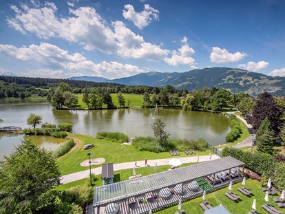 Luxusurlaub - Salzburg - Pergola und private Liegewiese am Ritzensee - Ritzenhof****S - Hotel & Spa am See